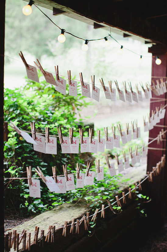 Rustic wedding place cards on string lights