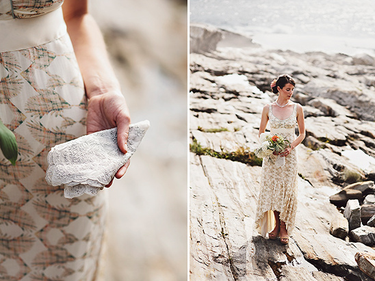 Bride in lace dress on rocks by the sea