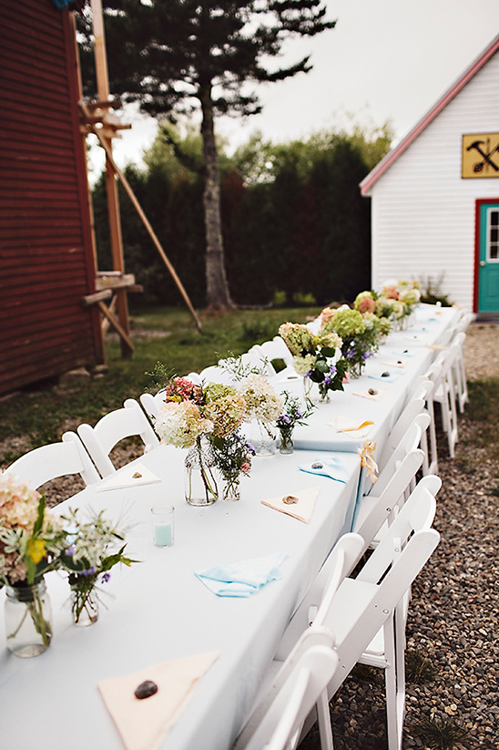 Elegant outdoor wedding table setting with flowers