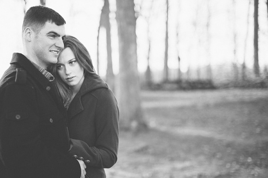 Black and white photo of a loving couple embracing outdoors