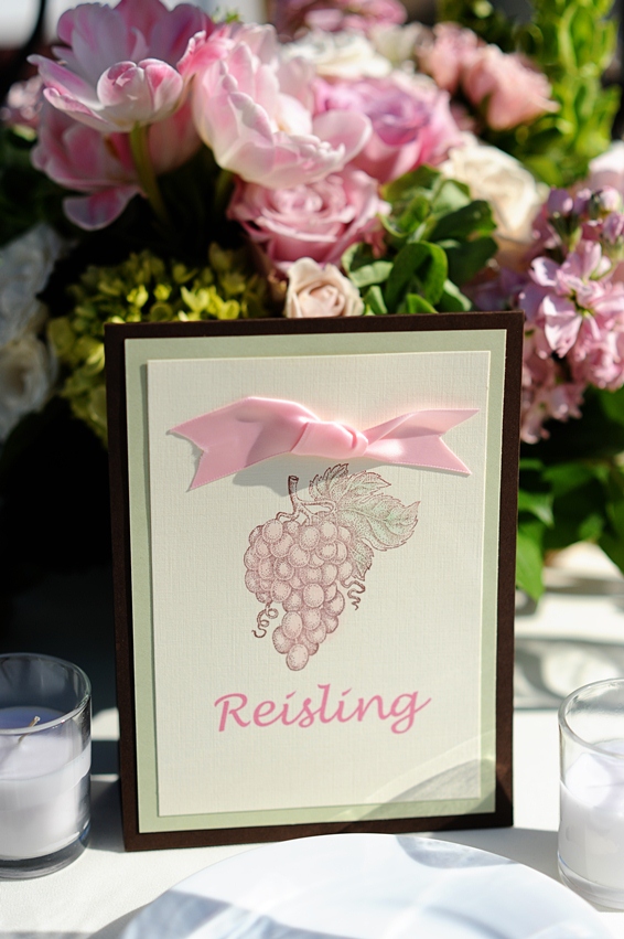 Riesling wine table card with pink ribbon and grapes