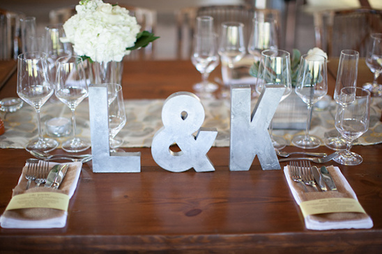 Wedding table setting with initials L & K and floral decoration