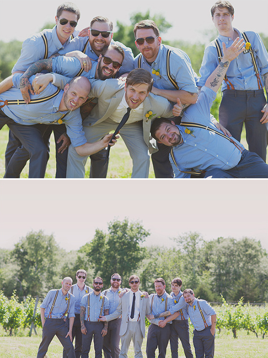 Wedding party groomsmen playfully posing in a group photo