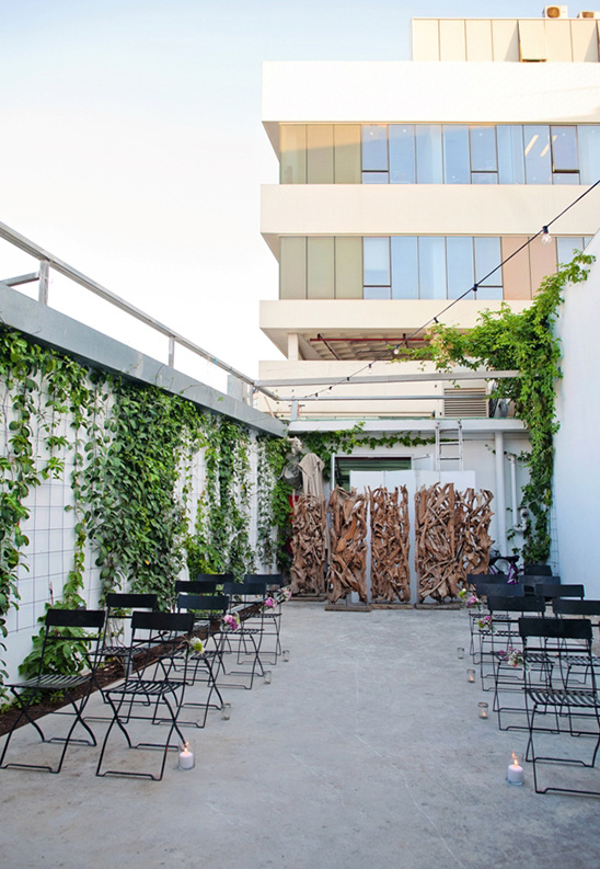 Outdoor ceremony space with chairs and building