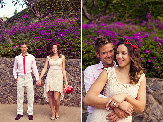 Happy couple embracing with purple flowers backdrop