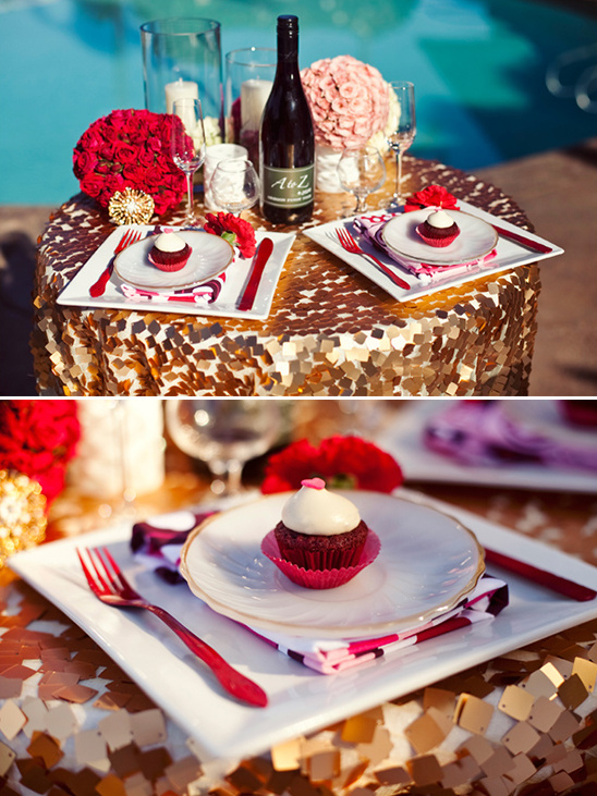 Romantic poolside dinner table setting with wine and dessert