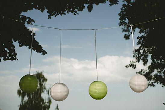 Hanging paper lanterns decorate outdoor event