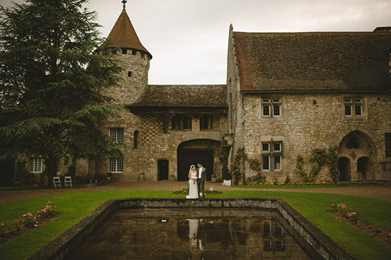Wedding couple posing at a medieval castle