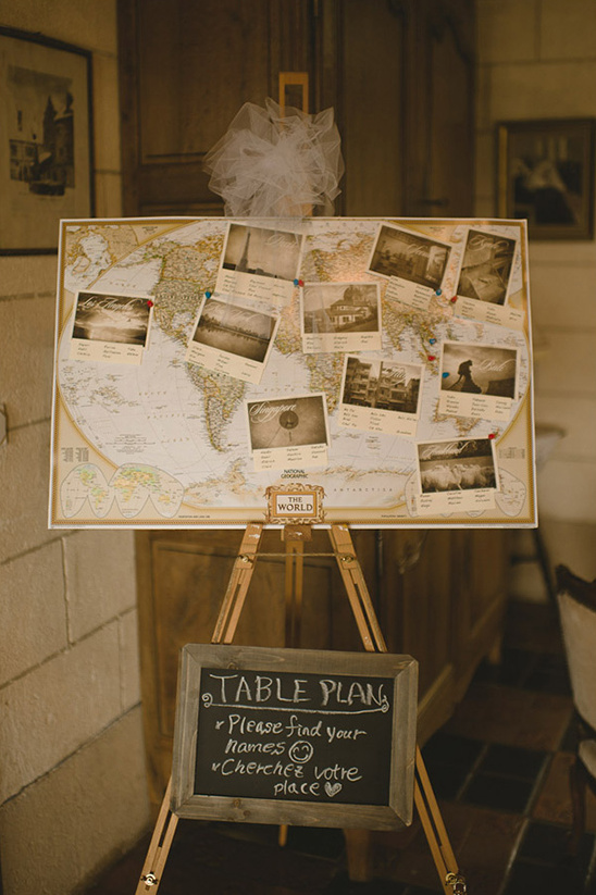 Wedding table plan on world map with photo inserts