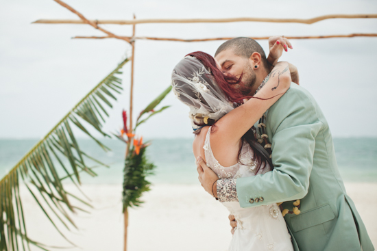 Romantic beach wedding kiss newlyweds embrace