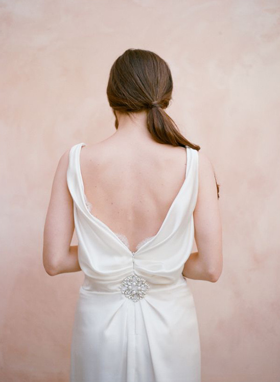 Bride in elegant white gown back view