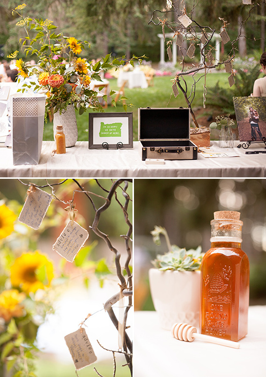 Outdoor wedding reception details with flowers and gifts