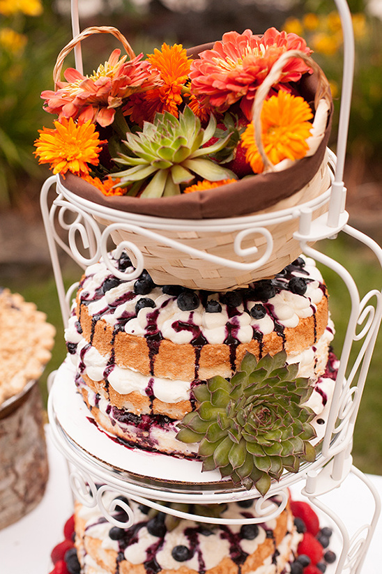 Three tiered cake with flowers and fruit filling