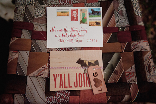 Southern themed wedding invitation on a tie quilt