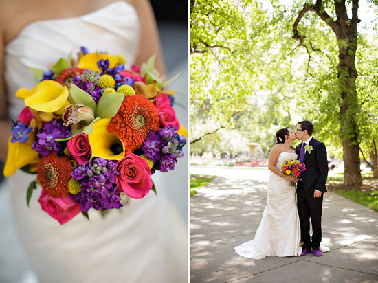 Bride and groom kissing with colorful bouquet at wedding