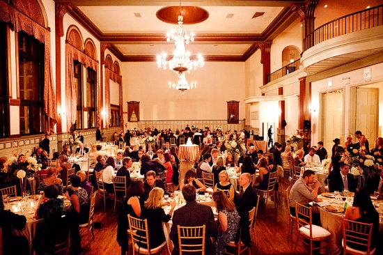 Elegant ballroom wedding reception with many guests