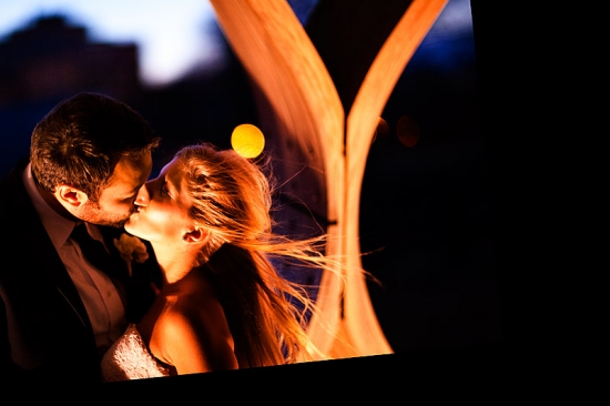 Romantic wedding couple kissing at night