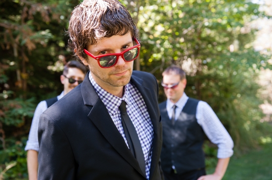 Men in suits, red sunglasses, outdoors
