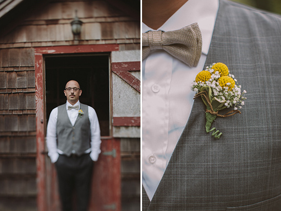 Stylish groom in vest with boutonniere, standing outside a barn