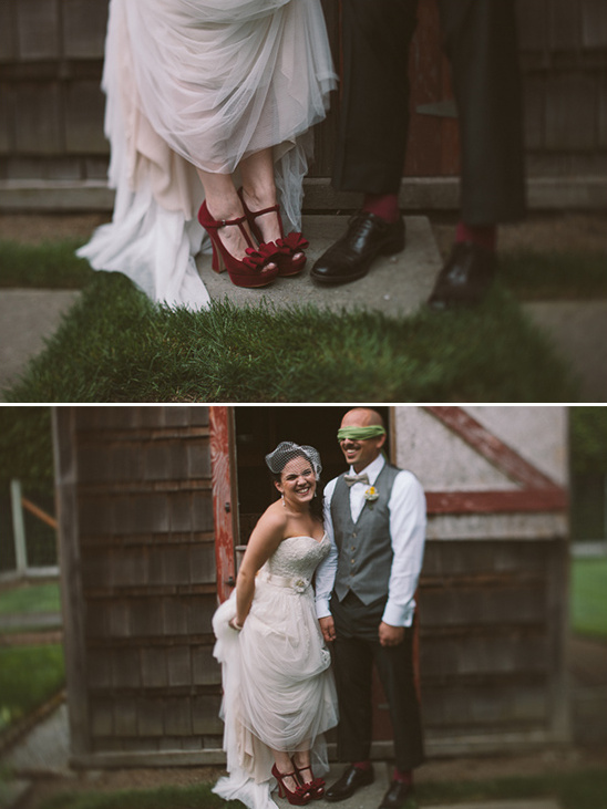 Bride and groom pose in front of an old door wearing matching red shoes