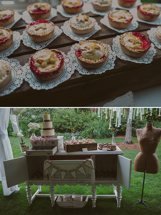 Mini pies on doilies at a wedding dessert table setting
