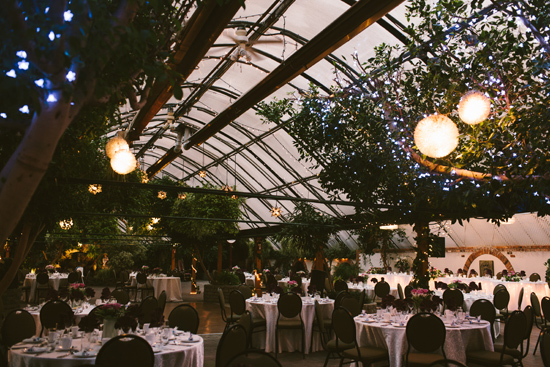 Romantic wedding reception with string lights and decorated tables