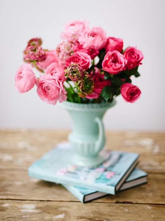 pink flowers in a mint vase