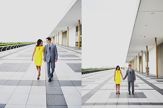 Couple in love walking on a modern pathway holding hands