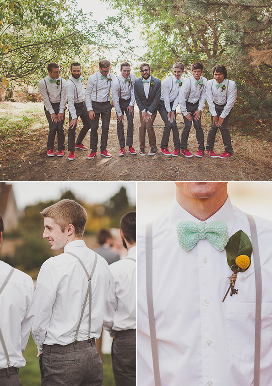 Wedding party in suspenders and red sneakers striking a pose