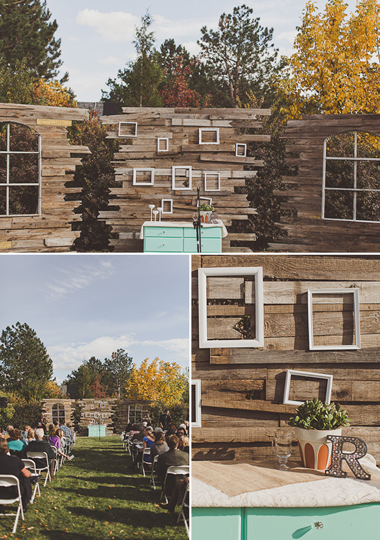 Rustic outdoor wedding with wooden backdrop and white frames