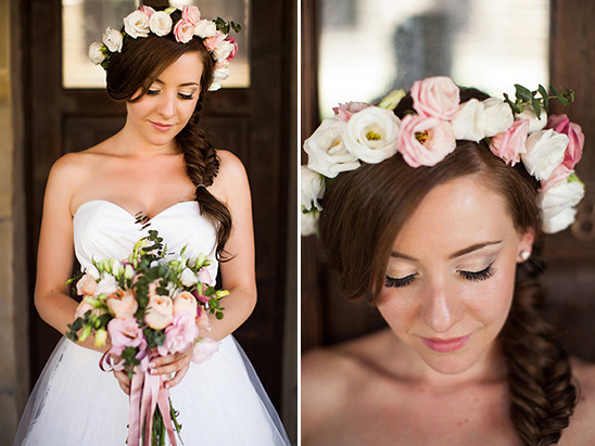 Bride with floral crown and braided hair, holding bouquet