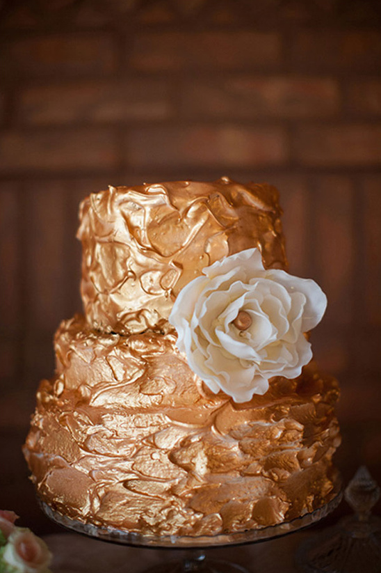 Golden wedding cake with textured frosting