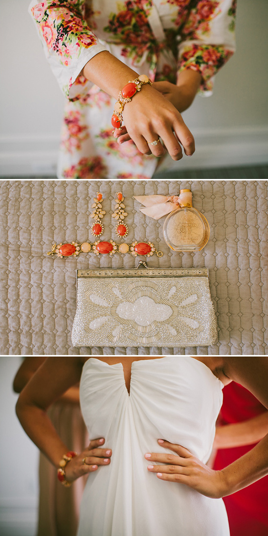 Bride getting ready with jewelry, perfume, clutch, and white dress