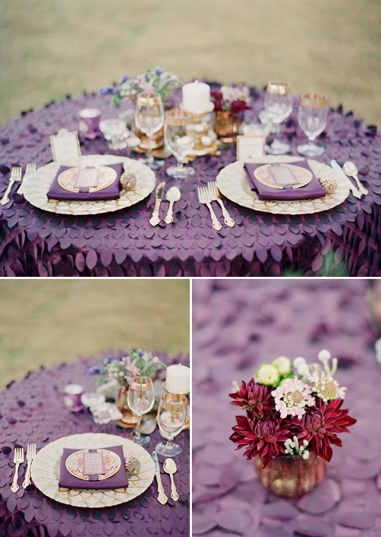 Elegant purple wedding table setting with gold accents