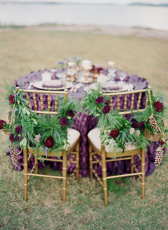 Elegant wedding setup with floral decor and gold chairs