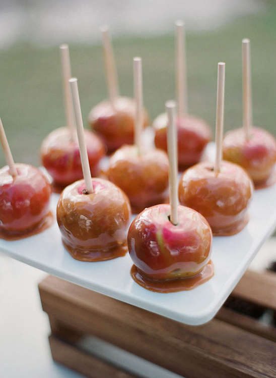 Caramel apples on a white plate, ready to be enjoyed