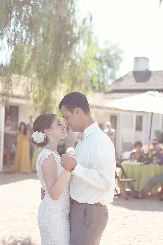 Newlyweds share a romantic first dance at their outdoor wedding
