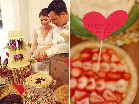Bride and groom cutting wedding cake with strawberry banana cream pie