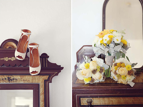 Bridal shoes and bouquets displayed on vintage wooden furniture