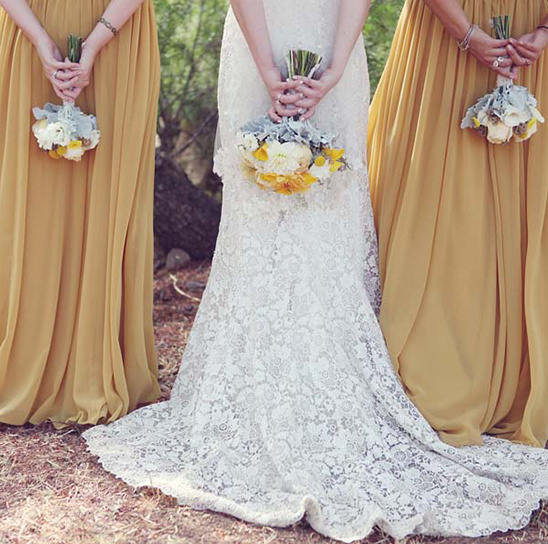 Bride and bridesmaids holding bouquets at a wedding
