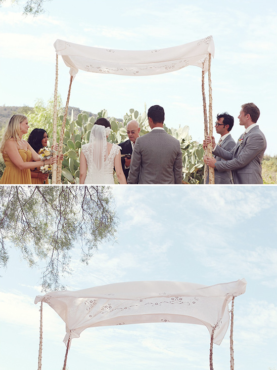 Outdoor wedding ceremony with chuppah and happy couple