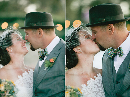 Bride and groom sharing a kiss at their wedding