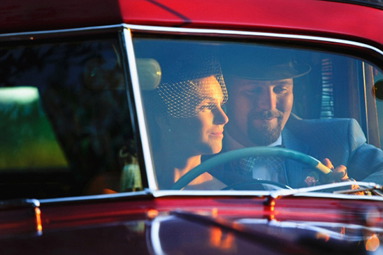 Couple in vintage car, wedding day