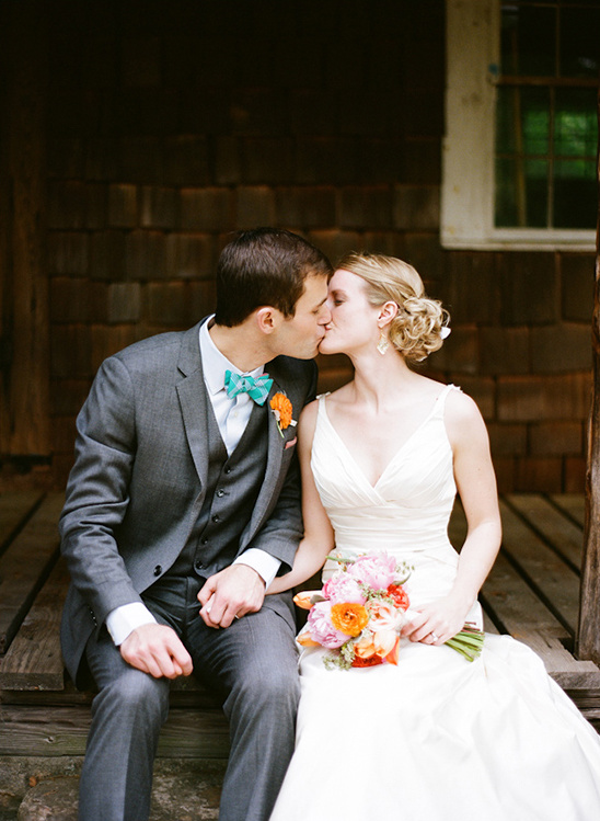 Newlyweds sharing a romantic kiss on their wedding day