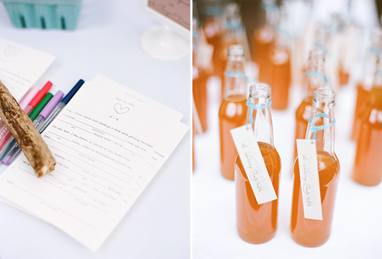 Wedding reception details with guest book and drinks on table