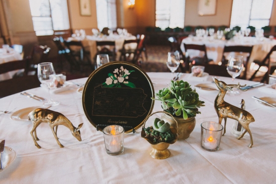 Gold deer, succulents, and state plate centerpiece
