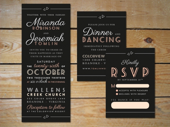 Elegant black and rose gold wedding invitation suite set on wood