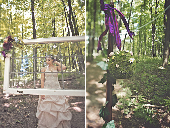 Bride in vintage dress and woodsy decor at forest wedding venue