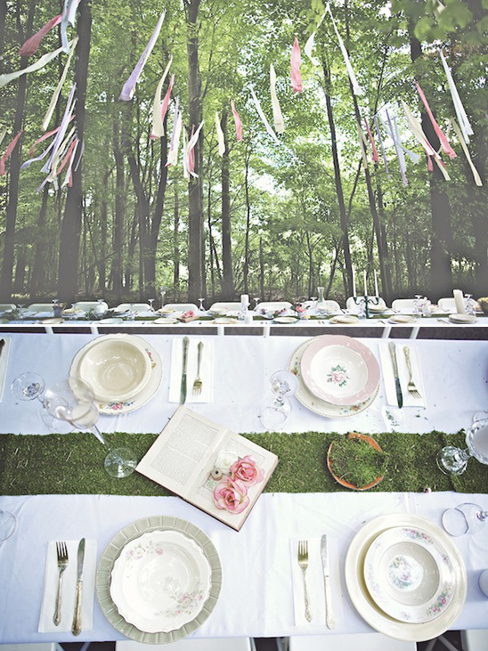 Elegant forest tablescape with ribbons and floral details