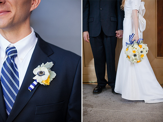 Elegant couple celebrating a nautical wedding with bouquets and suits
